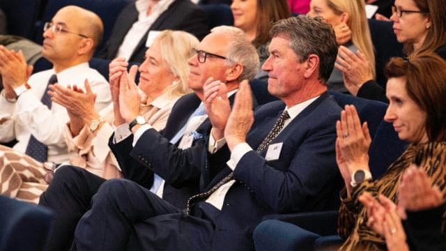 An audience applauding at a Windsor Leadership event